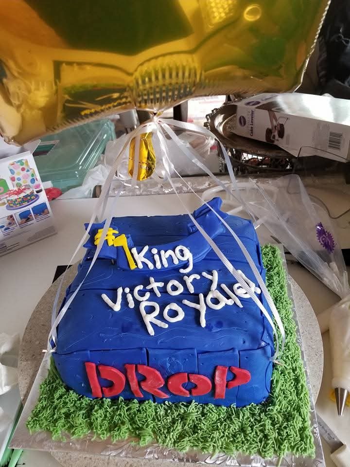 Close-up of a custom fondant birthday cake with piped lettering